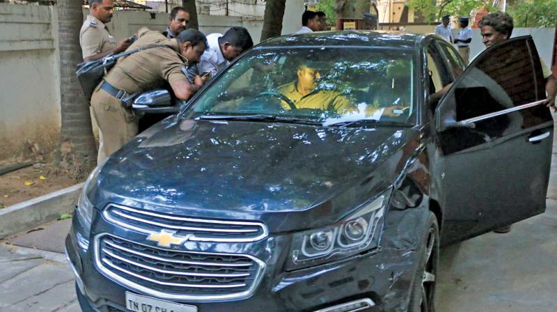 A policeman examines the car that hit the aged couple on CP Ramaswamy Road in Alwarpet on Wednesday.	(Photo:DC)