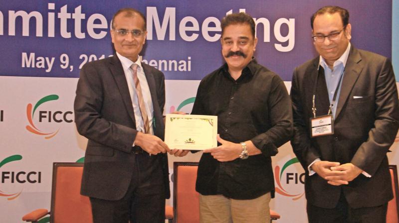 Actor and Founder of Makkal Needhi Maiam Kamal Haasan addressing at special session of FICCs national executive committee meeting on Wednesday. 	(Photo:DC)