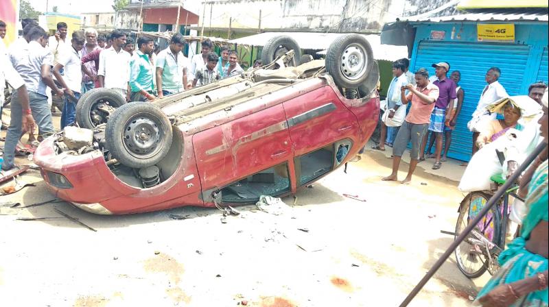 The car that got toppled in the mob attack in Athimoor village, near Polur on Wednesday.