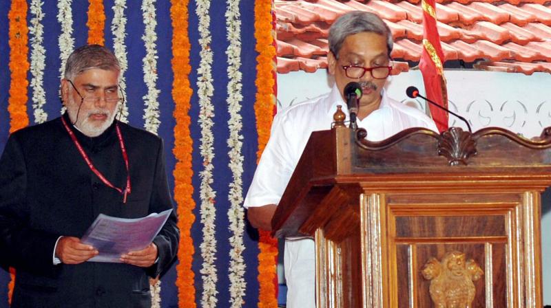BJP leader Manohar Parrikar taking oath as Goas new Chief Minister at a swearing-in ceremony in Panaji on Tuesday. (Photo: PTI)