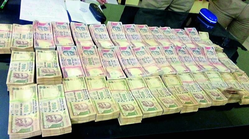 Police on Monday seized 30 lakh in banned notes from a man named Kanakaiah during a routine vehicle check at Jangaon on Monday. Kanakaiah was a trader in Hanamkonda and was taking the cash to Hyderabad in his car. 	(Photo: DC)