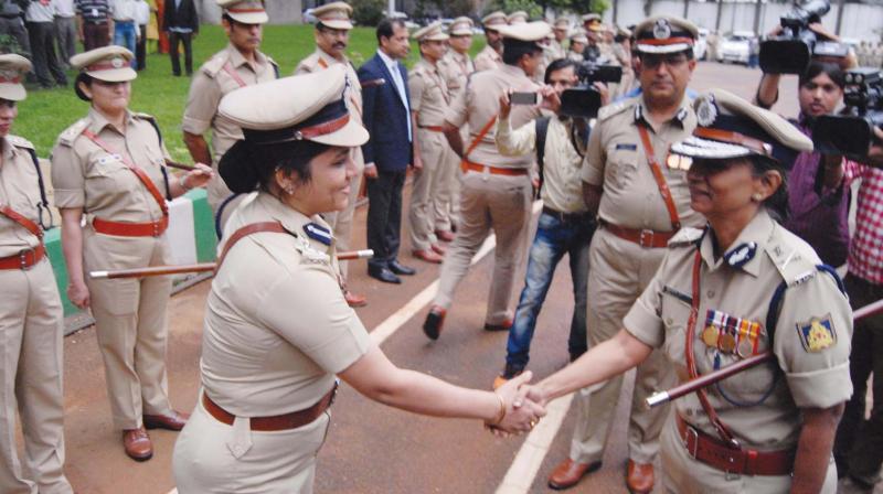 Neelamani Raju with DIG Roopa after taking charge as DG&IGP on Tuesday. (Photo: DC)