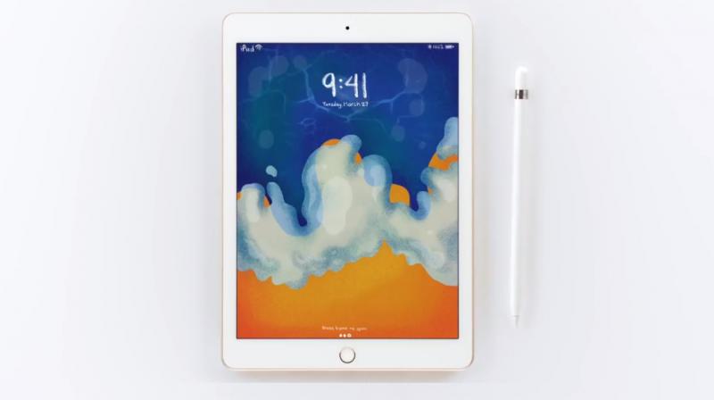 Apples new 9.7-inch iPad with its pencil stylus.