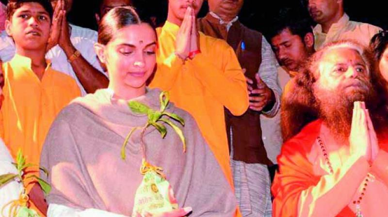 Deepika with the Rudraksha sapling