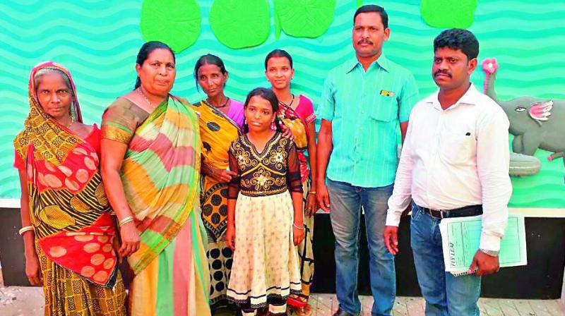 Andhra Pradesh police reunite Puja Khaudia with her parents Shyam Khaudia and Muni Khaudia on Saturday in Odisha.