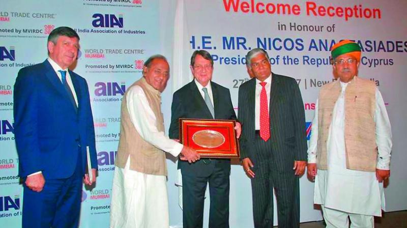 World Trade Centre, Mumbai, chairman Kamal Morarka presents a momento to Cyprus President Nicos Anastasiades.