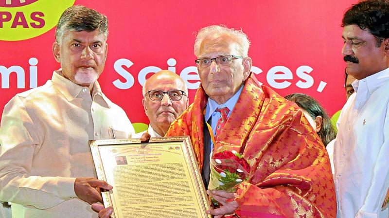 Chief Minister N. Chandrababu Naidu presents the Lifetime Achievement award to Kakarla Subba Rao during the AP Science Congress function in Vijayawada on Monday. (Photo: DC)