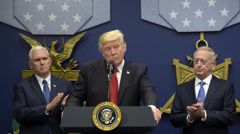 President Donald Trump, center, flanked by Vice President Mike Pence, left, and Defense Secretary James Mattis, right. (Photo: AP)