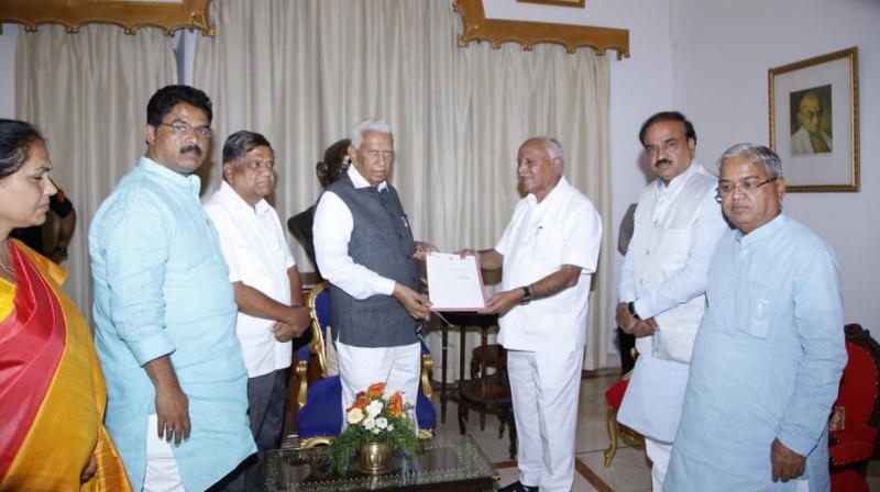 B S Yeddyurappa hands over his resignation to Karnataka Governor Vajubhai Vala. (Photo: ANI | Twitter)