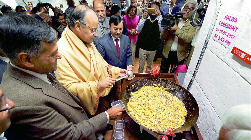 Union finance minister Arun Jaitley taking part in the Halwa Ceremony to mark the beginning of printing of budgetary documents, in New Delhi on Thursday. (Photo: PTI)