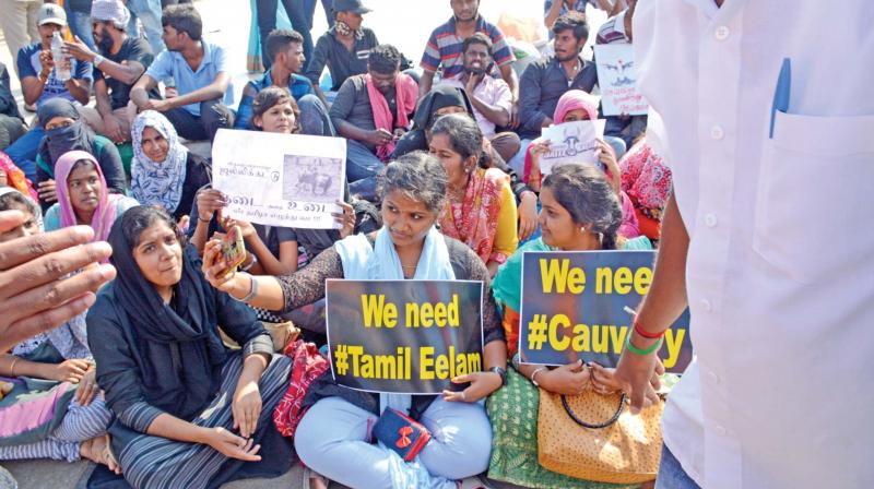 Women hold banners supporting Tamil Eelam and Cauvery water causes during the Marina protests on Thursday. (Photo: DC)