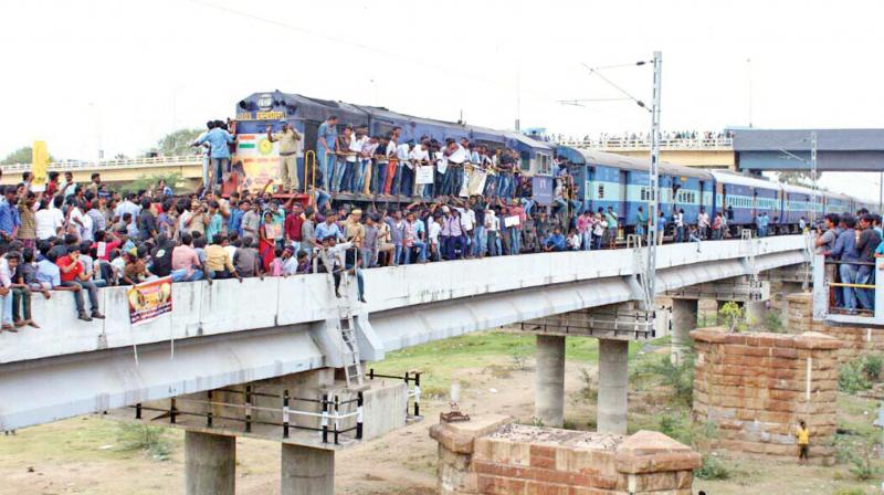 Students block a train in Madurai on Thursday. (Photo: DC)
