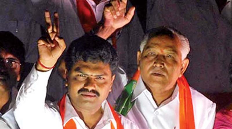 Shivamogga BJP candidate B.Y. Raghavendra and father B.S. Yeddyurappa