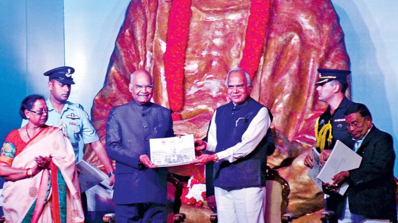 President Ram Nath Kovind releases a commemorative postage stamp on the occasion of the centenary year of Dakshin Bharat Hindi Prachar Sabha at  T Nagar after unveiling a statue of Mahatma Gandhi in presence of Tamil Nadu Governor Banwarilal Purohit and Justice V Patil, president and chancellor of Hindi Prachar Sabha. (Photo: DC)