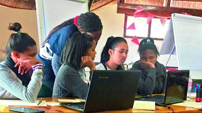Girls study launch procedure during a boot camp session in Cape Town, South Africa (Photo: Via Web)