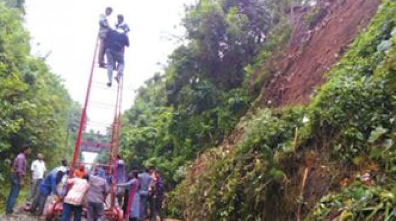 Railway workers engaged in track restoration work after after a tree fell on the tracks early on Tuesday. (Photo: DC)