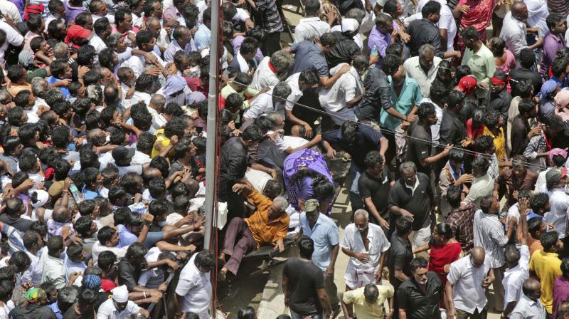 Several people have suffered injuries in the stampede that happened when the police were allowing them to enter the Rajaji Hall in batches. (Photo: AP)