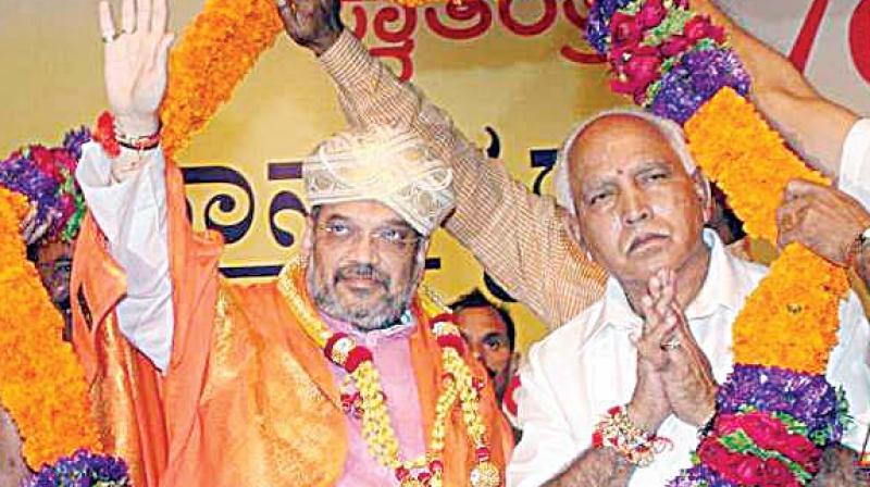 A file photograph of BJP national president Amit Shah with  party state president and former chief minister B.S. Yeddyurappa.