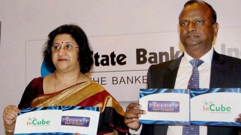 SBI chairman Arundhati Bhattacharya with Rajnish Kumar at an event. (Photo: PTI)