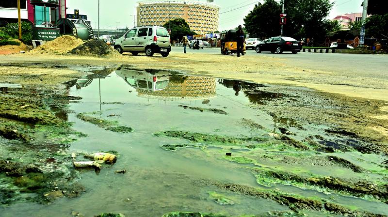Drainage water flows in front of the Shilparamam at Hitec City on Thursday, when the Government of India picked the Greater Hyderabad Municipal Corporation for the national award under the category of the best civic maintained tourist places in the twin cities. (Photo:DC)