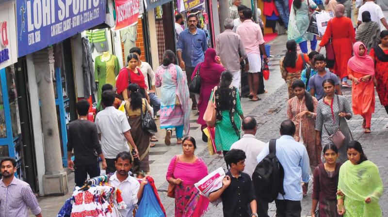 After an interval people started moving on the SM Street, an otherwise busy business hub of Kozhikode on Friday. 	(Photo: DC)