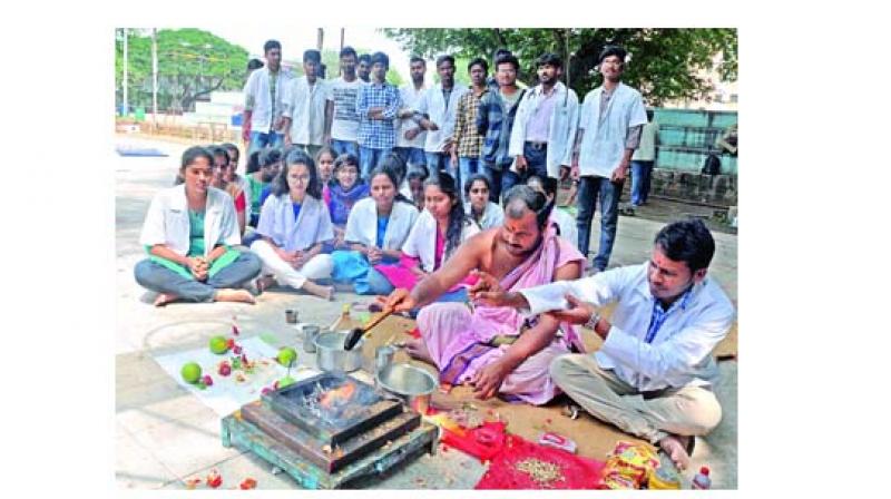 Students of Osmania University perform homam for the construction of new hospital building on Tuesday. (Photo:P. Surendra)