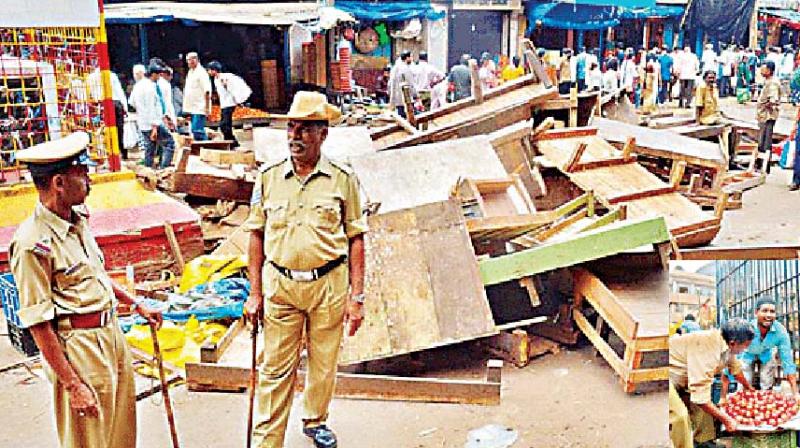 A file picture of illegal shops being demolished in KR Market in Bengaluru 	DC