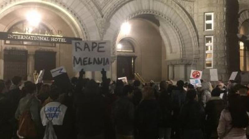 Anti-Trump protesters holding sign board that states Rape Melania and protesting outside President-elects hotel in Washington D.C. (Photo: Twitter)