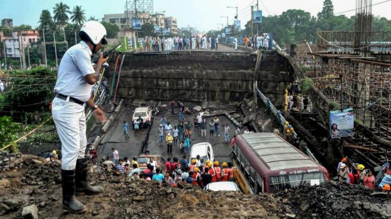 Labourers working on the metro project claimed two of their co-workers, who were probably inside a temporary shelter underneath the bridge, are still missing. (Photo: PTI)