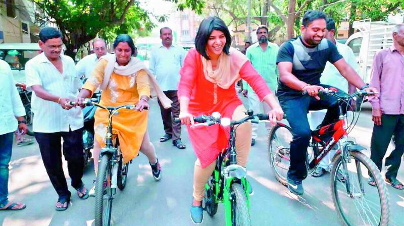 GHMC central zone commissioner Hari Chandana Dasari (centre) and staff take to bicycles to inspect roads in Ameerpet on Thursday, after Chief Minister K. Chandrasekhar Rao ordered that all potholes be filled. â€œThe main purpose of the inspection on bicycles was to help us identify potholes easily. Cycling will send out a message of free transportation,â€ said Ms Dasari.