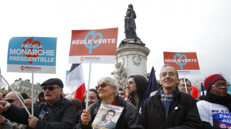 Supporters of hard-left French presidential candidate Jean-Luc Melenchon march through the French capital.