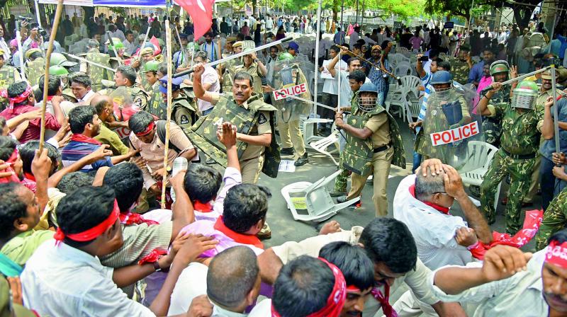 Cops use lathis to chase away protesters during the Chalo Indira Park rally in Hyderabad on Monday. (Photo: DC)