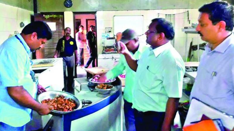 A file photograph of GHMC officials checking the hygiene conditions at a restaurant in the city. (Photo: DC)