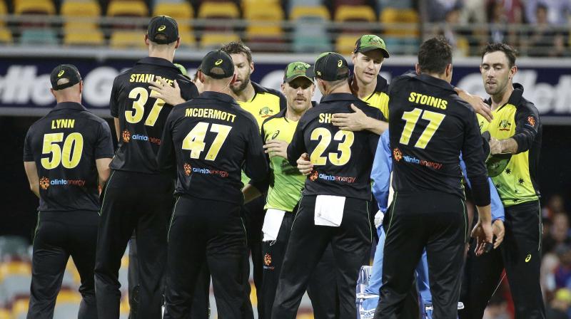Australian players celebrate after winning the first T20 against India. (Photo: AP)