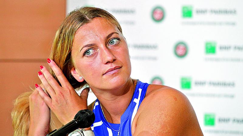 Petra Kvitova of the Czech Republic adjusts her hair during a press conference at the Roland Garros Stadium in Paris on Friday, ahead of the French Open. (Photo: AP)