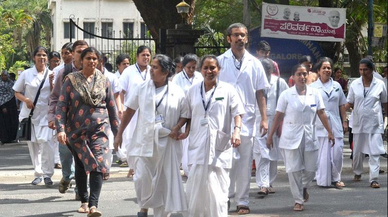 Close to 300 nurses at the Institute of National Importance protested against an acute shortage of staff on Tuesday. (Photo: DC)