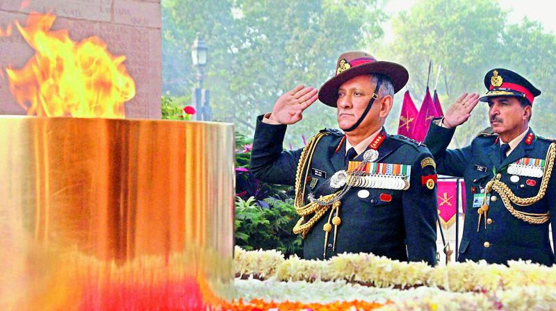 Chief of Army Staff, General Bipin Rawat paying homage at amar Jawan Jyoti at India Gate, in New Delhi on Sunday.  (Photo: PTI)
