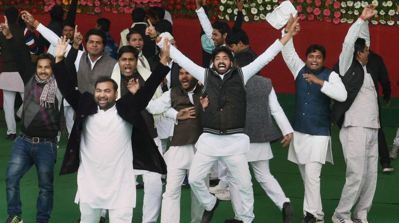 SP workers celebrate after UP Chief Minister Akhilesh Yadav elected partys national president unanimously during Samajwadi party national convention in Lucknow on Sunday. (Photo: PTI)