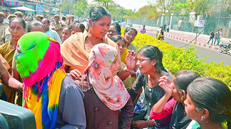 First year students of Sri Vasavi junior college at Vanasthalipuram break into tears as they are taken into custody following a protest near the Secretariat. Over 200 students have been left in the lurch after their college was not given hall tickets for the Inter tests. (Photo: DC)