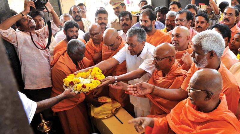 CM pays floral tributes at Sivagiri on the occasion of the 84th pilgrimage season on Friday.