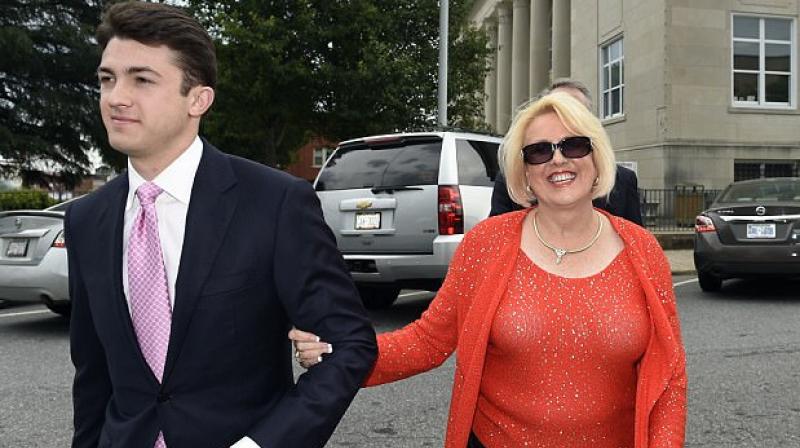 Brooke Covington, a member of the Word of Faith Fellowship church in Spindle, North Carolina, leaves a hearing on May 19, 2017, at Rutherford County Courthouse accompanied by attorney Joshua Valentine. (Photo: AP)