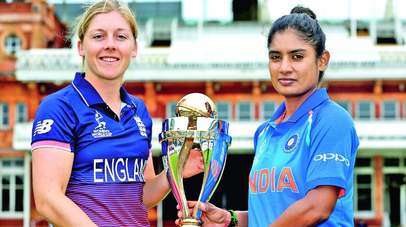 Rival captains Heather Knight (left) and Indias Mithali Raj pose with the WC at Lords on Saturday. (Photo: Agencies)