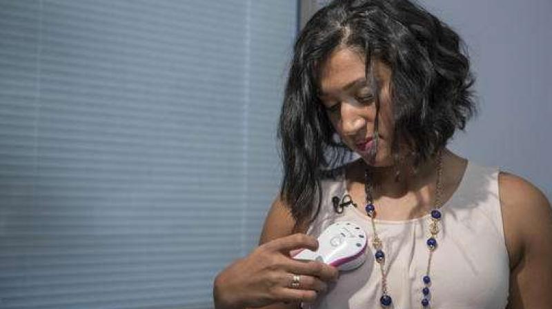 Luincys Fernandez demonstrates how she had used the AeroForm handheld dosage controller during an interview at NewYork-Presbyterian/Columbia University Medical Center. (Photo: AP)