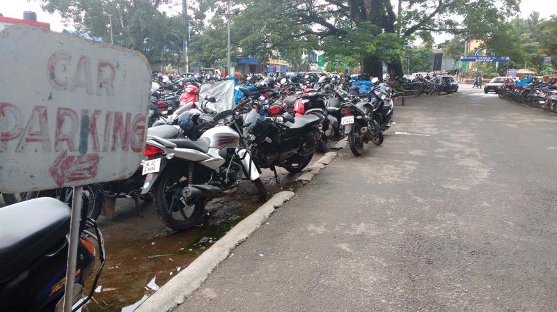 Vehicles parked in the open at south railway station.