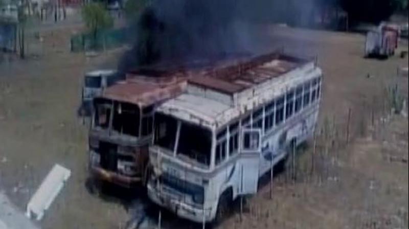 Agitated farmers in Madhya Pradesh set vehicles ablaze. (Photo: ANI Twitter)