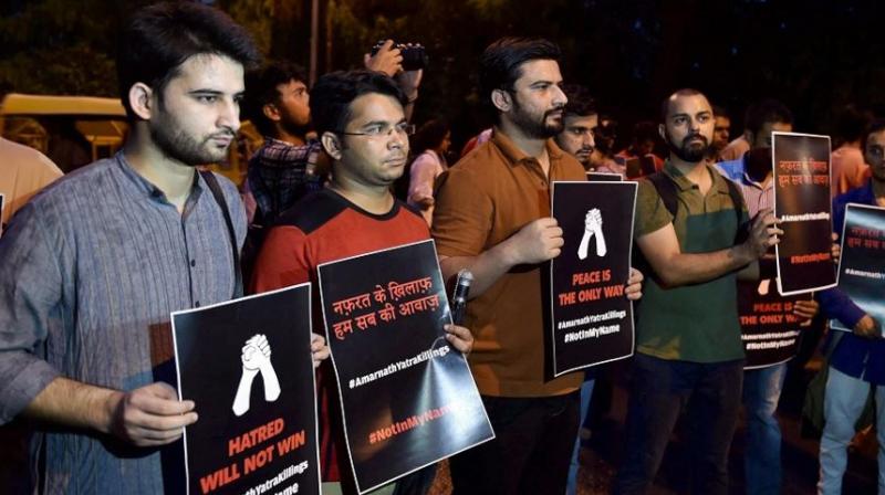 Activist of the Not In My Name campaign held silent protests at Jantar Mantar on Tuesday evening demanding for a peaceful India. (Photo: PTI)