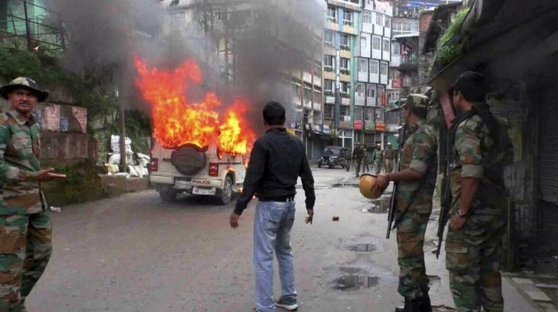 A vehicle in flames after it was set on fire by the protesters in Darjeeling on Wednesday. (Photo: PTI)