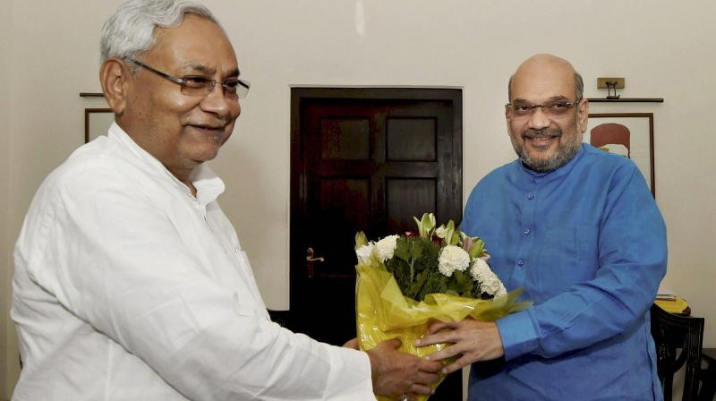 Bihar Chief Minister Nitish Kumar meets BJP president Amit Shah in New Delhi. During the meeting both the leaders are believed to have discussed ongoing political developments and other issues related to Bihar. (Photo: PTI).