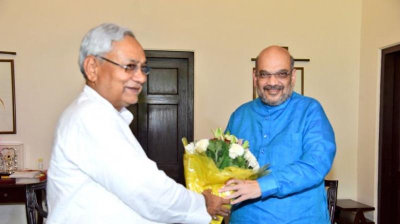 On Friday Bihar Chief Minister and JD(U) President met BJP national President Amit Shah in New Delhi. (Photo: Twitter | @AmitShah)