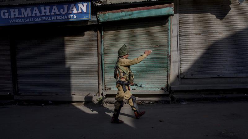 Kashmir and parts of Chenab valley of Jammu region were shut on Saturday to protest against alleged  devious attempts  being made at the behest of Sangh Parivar to abrogate Article 35A and Article 370 of the Constitution. (Photo: AP)